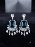Deep teal-blue statement chandelier earrings